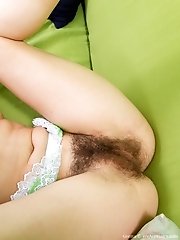 Hairy beauty Gretta on the couch