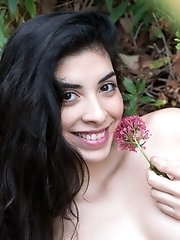 Ornella strips outdoors with a sexy rose in hand