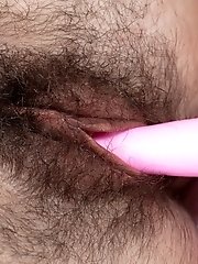 Dalila wakes up in bed and masturbates with toy