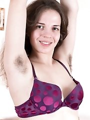 Fiorella strips off purple dress on her brown sofa