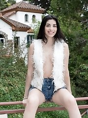 Ornella strips naked outdoors to show off body